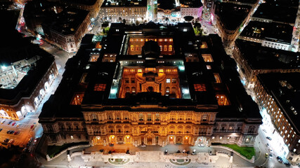 Aerial drone night shot from illuminated Cassation court Palace of justice, the highest supreme court of Italy next to famous piazza Cavour, Rome historic centre