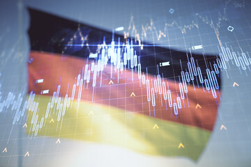 Double exposure of abstract creative financial diagram and world map on flag of Germany and blue sky background, banking and accounting concept
