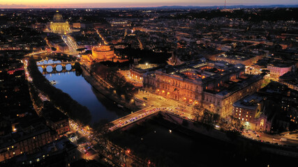 Aerial drone night shot from illuminated Cassation court Palace of justice, the highest supreme court of Italy next to famous piazza Cavour, Rome historic centre