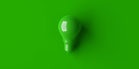 Green light bulb over green background, minimal modern energy technology or sustainability idea concept, flat lay top view from above