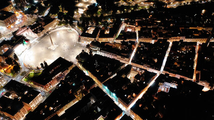 Aerial drone night shot from iconic illuminated Piazza del Popolo or People's square, an elliptical...
