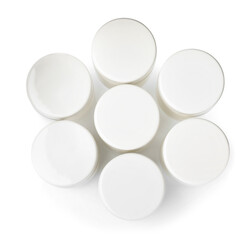 Portion jars for yogurt maker on white background, top view