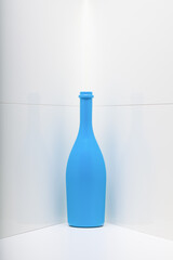 Blue wine bottle on the white background
