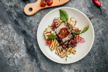 steak barbecue sliced with salad grilled vegetables, nuts, sauce and parmesan. Italian cuisine concept. banner, menu, recipe place for text, top view