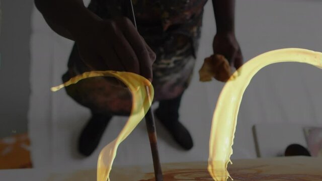 Animation of african american man painting over paint