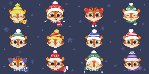 Set a collection of twelve cute tiger in a winter hat and a scarf of different designs on a blue background, snowflakes. Cartoon, flat style, vector.