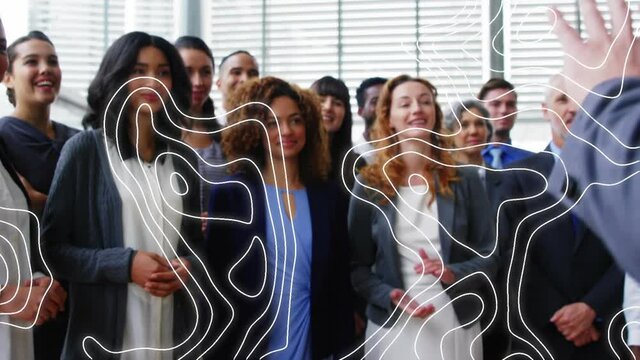 Animation of isohypses over diverse male and female business colleagues clapping hands in office