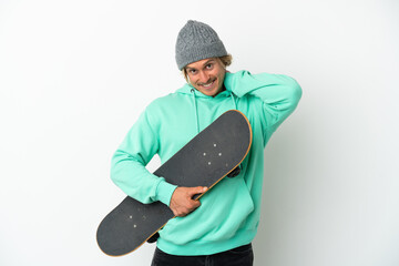 Young skater blonde man isolated on white background laughing © luismolinero