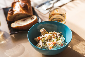 venezuelan salad on display on table with traditional pan de jamon or ham bread, with cutlery and ready. traditional dishes of venezuelan cuisine