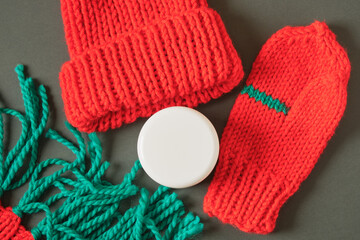 White cosmetic jars on green background. Christmas sale of beauty products concept. copy space