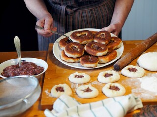 The process of home cooking whites, small pies with natural meat and the addition of vegetables.