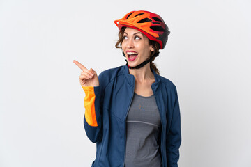 Young cyclist woman isolated on white background intending to realizes the solution while lifting a finger up