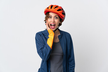 Young cyclist woman isolated on white background with surprise and shocked facial expression