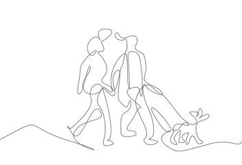 couple in love taking a walk with their dog