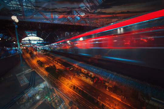 Abstract city night blurred light double exposure moving train and people background. Concept image.