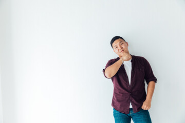 portrait of a male Asian dancer in a white hall