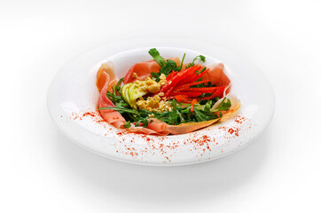 Plate with food insulated - salad with red fish salmon, arugula, cheese, red paprika. Healthy food, food for health, diet food serving