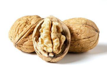 Walnuts on a white background. Nut - a source of vitamins and useful trace elements. Close up.