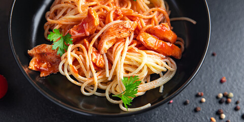 pasta spaghetti tomato sauce chicken meat or turkey healthy meal food diet snack on the table copy space food background rustic. top view