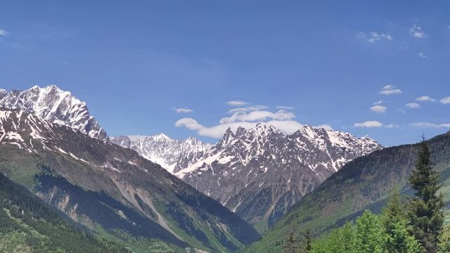 Mt. Ushba double peaks in the summertime.  Time-lapse