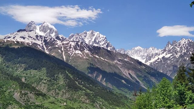 Landscape with the sky. Double peak mountain Ushba. 1:26 - raw footage for time lapse 