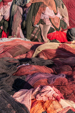 background of colorful fishing nets and floats. Pile commercial fish nets and gill nets