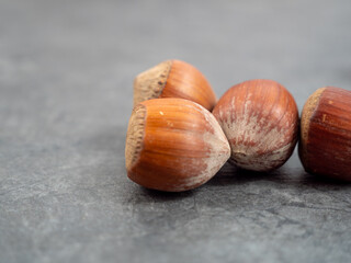 Hazelnuts on a wooden background.