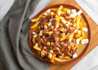 The original poutine with fresh cheese curds and hot gravy melted to perfection 