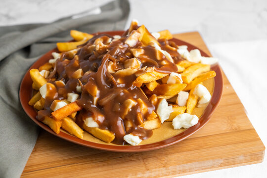 The original poutine with fresh cheese curds and hot gravy melted to perfection 
