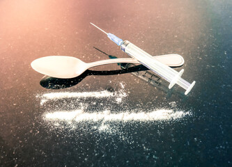 Syringe, teaspoon and cocaine rails 