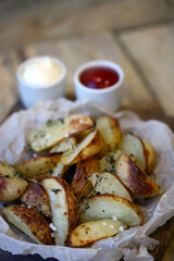 Appetizing French fries with sauces.