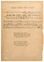 Old music sheet Silent Night popular Christmas carol paper background