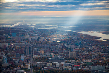 Fototapeta na wymiar A ray of light falling on the city of Samara in autumn. Aerial photo. Samara, Russia.