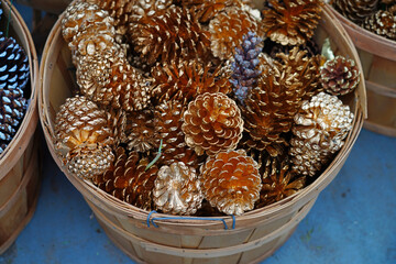 Buckets of decorative gold pinecones for the holidays