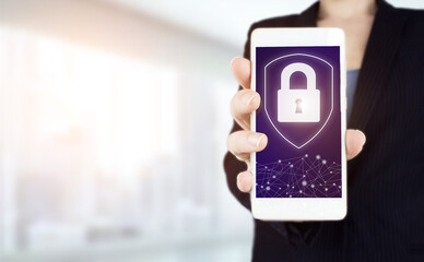 Cyber security, digital crime concept. Hand hold white smartphone with digital hologram lock, padlock sign on light blurred background. Data protection privacy concept. GDPR. Cyber security network.