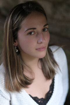 Portrait of a young woman with mid-length blonde hair