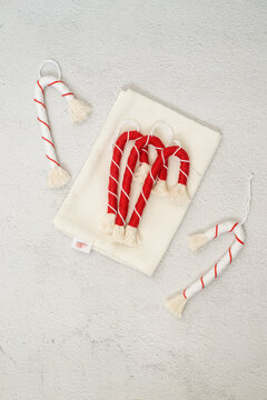 Overhead view of macrame Candy cane decorations on a table