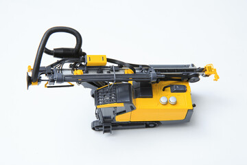 Fototapeta premium Drilling machine for contour drilling of boreholes for blast preparation in the quarry. The layout of a small quarry drilling rig on a white background.