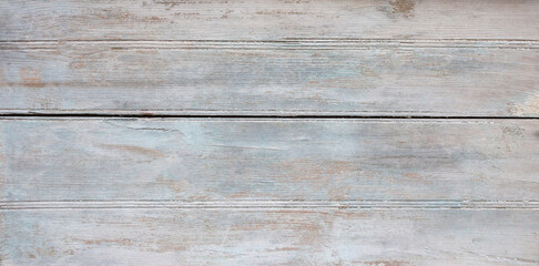 Obraz premium Old blue and grey wooden background with cracks and scratches in vintage style