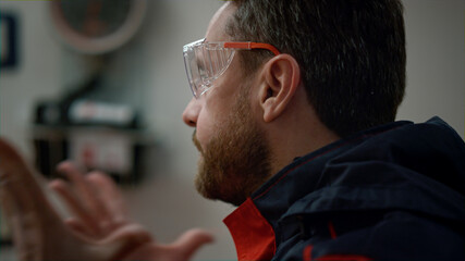 Emotional paramedic having conversation with colleague in emergency car