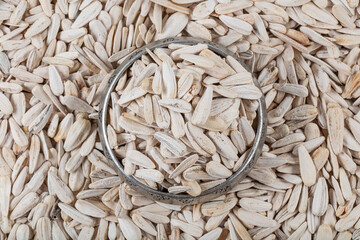 organic sunflower seed for background uses. baked sunflower seeds, top view.