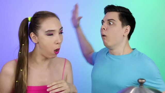 The girl with bright makeup choked. A young man rescues his girlfriend.