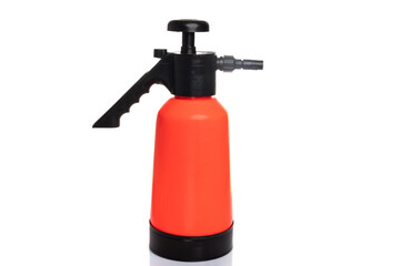 orange garden hand sprayer on white isolated background
