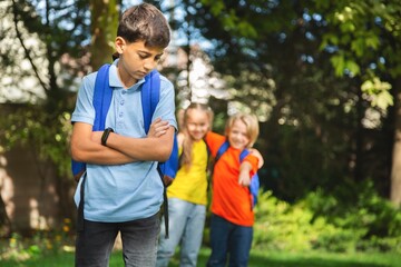Fototapeta premium Upset school child on outdoor background