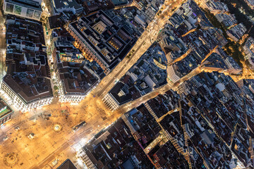 Night aerial views of Puerta del sol and its confluence with Calle Alcalá and Carrera de San Jerónimo in the city of Madrid
