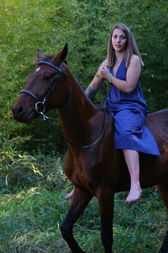 Portrait of a woman riding a horse bareback, France