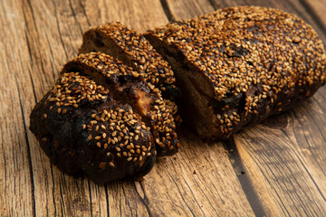 Grain bread on a wooden background.Proper nutrition at home.