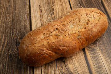 Grain bread on a wooden background.Proper nutrition at home.