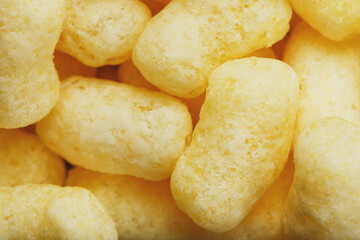 Yellow dessert Corn sticks in powdered sugar texture.