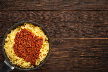 Frying pan tagliatelle with BOLOGNESE SAUCE with copy space